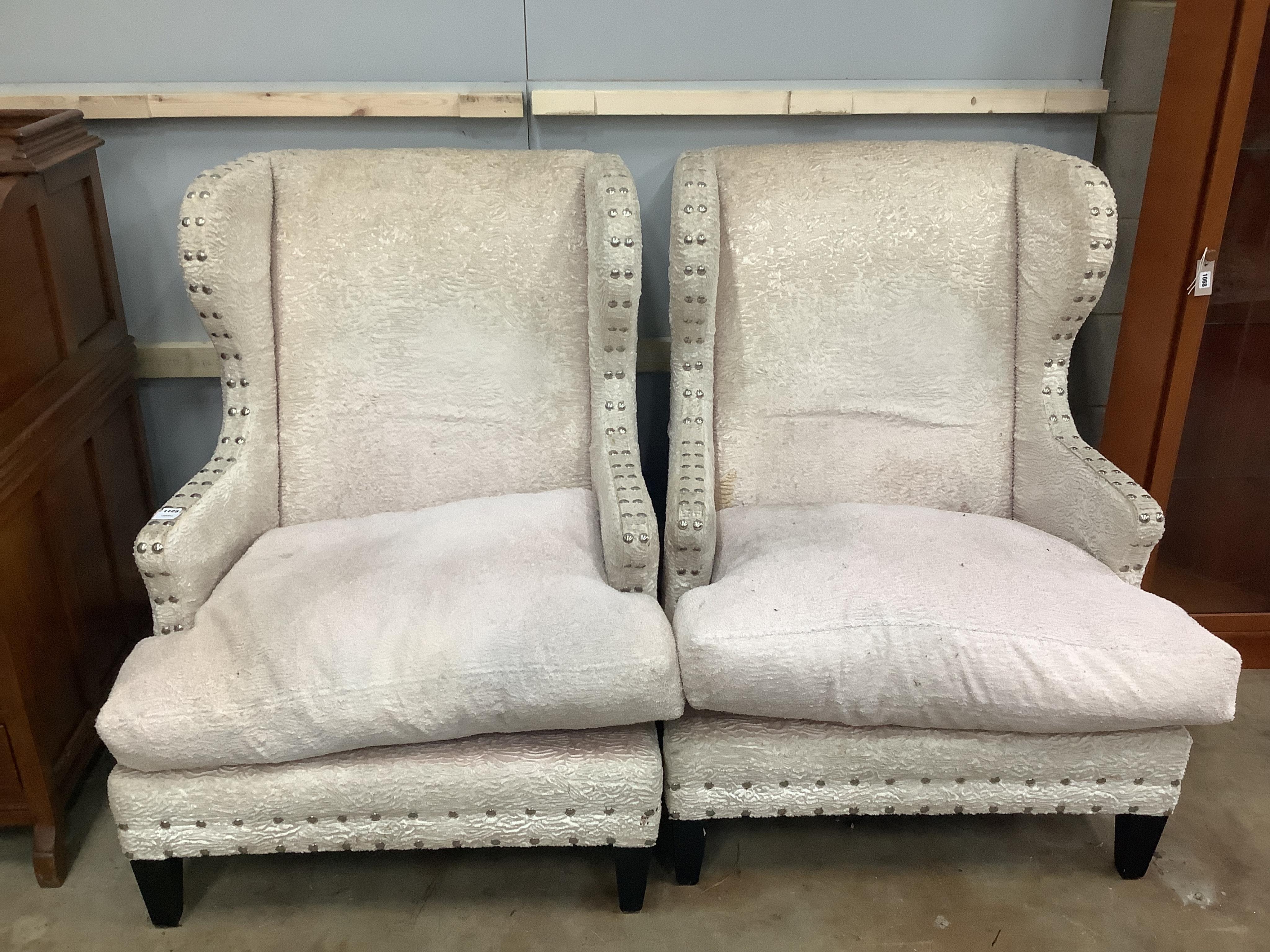 A pair of Martin Fleming armchairs with zebra cushions, width 85cm, depth 80cm, height 112cm. Condition - fair